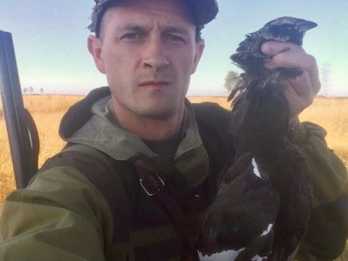 В полях.