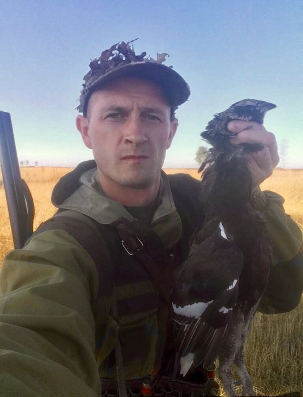 В полях.